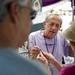 Illinois resident Harry Mackie talks to customers about his handcrafted contemporary jewelry during the Ann Arbor Art Fair on South University Avenue on Saturday, July 20. Daniel Brenner I AnnArbor.com